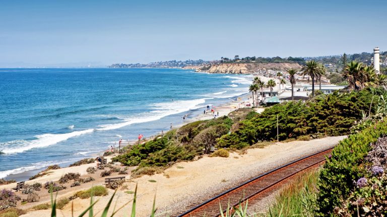 Del Mar Beach sandy shoreline and ocean waves San Diego